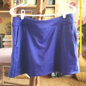 Under Armour 2 in 1 skirt,shorts underneath.